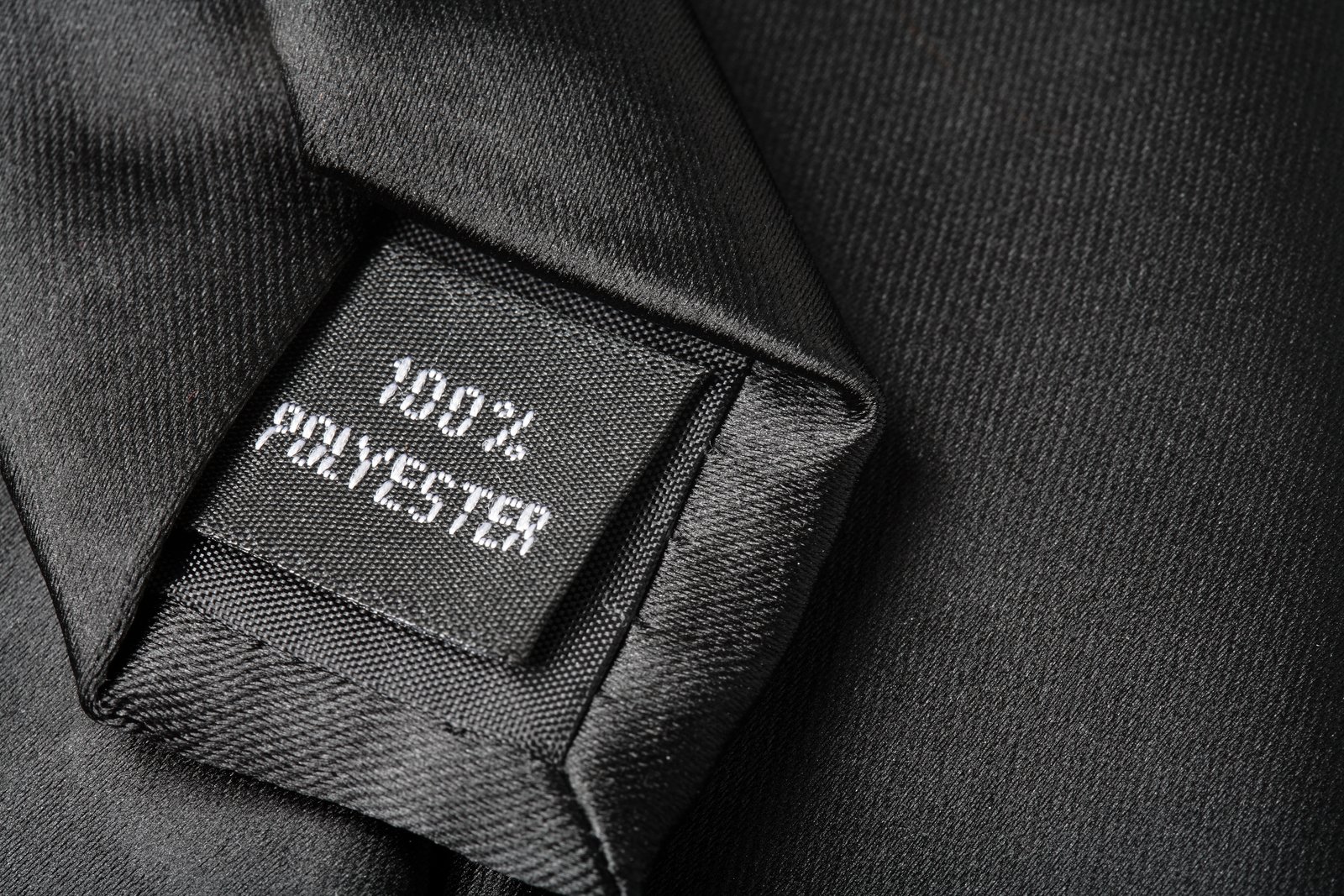 tie label that reads 100% polyester.