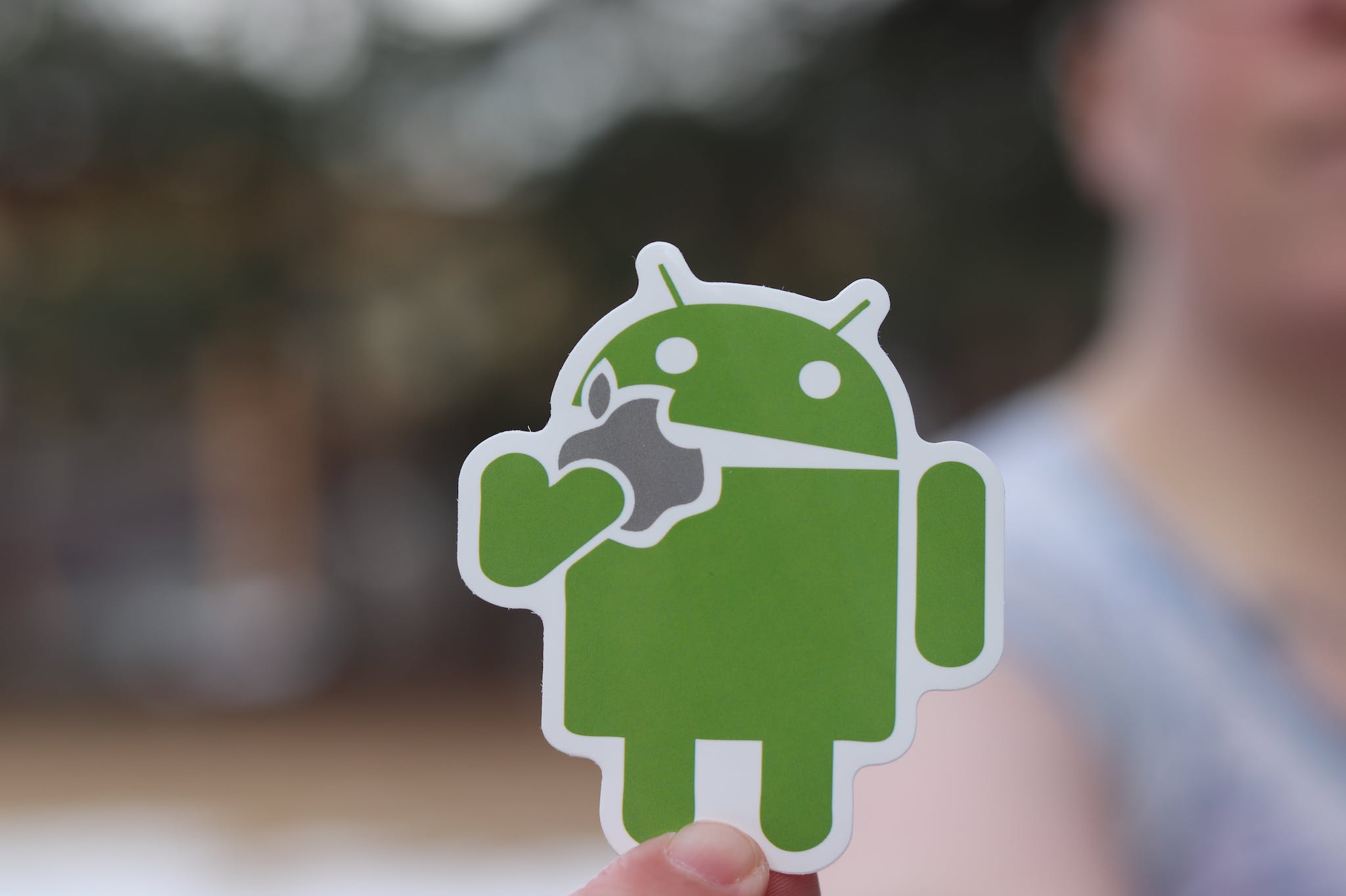 Close Up Photo of a Green Android Sticker.